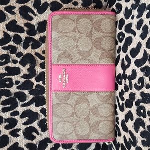 Brown monogram wallet with pink accent